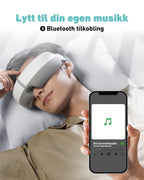SKG øyemaske koblet til mobil via Bluetooth, lar deg lytte til din egen musikk mens du får massasje mot hodepine.